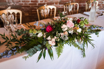 long and low table arrangement of flowers