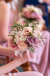 bridesmaids bouquet against a pink satin dress